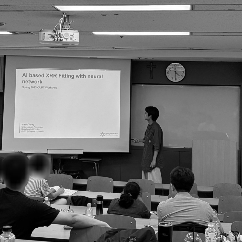 Isaac presenting a talk titled AI based XRR Fitting with neural network at the Spring 2025 CUPT Workshop, standing beside the projected title slide in a lecture room. Audience faces are blurred.